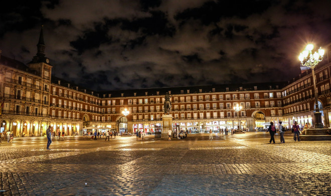 The Plaza Mayor was built during the Habsburg period and is a central plaza in the city of Madrid, Spain. It is located only a few Spanish blocks away from another famous plaza, the Puerta del Sol. The Plaza Mayor is rectangular in shape, and is surrounded by three-story residential buildings having 237 breathtaking balconies facing the Plaza.