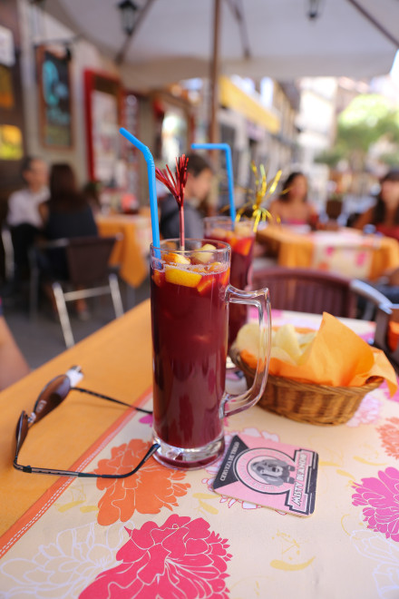 Sangria normally consists of wine, chopped fruit, a sweetener, and a small amount of added brandy. Chopped fruit can include orange, lemon, lime, apple, peach, melon, berries, pineapple, grape, kiwifruit and mango. A sweetener such as honey, sugar, syrup, or orange juice is added. Instead of brandy, other liquids such as Seltzer, Sprite or 7 Up may be added. Sangria is named after the Latin word for "blood" – "sanguis " because of its typical dark-red color