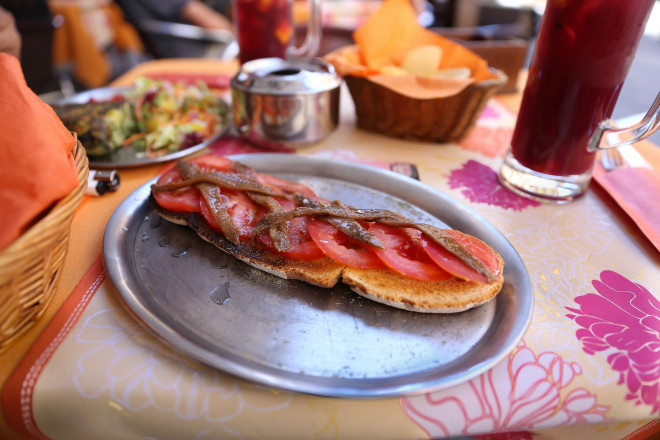 Pan con tomate y anchoas Españoles: toasted slices of rustic bread brushed with fresh tomato with Spanish anchovies